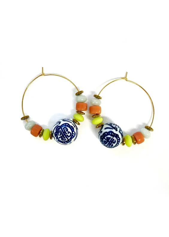 Hoop earrings with twisted metal designs for a dynamic and modern style-CALIOPE