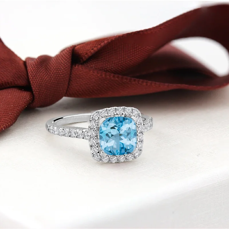 Rings with vintage claw prongs for elegance -Auriya 1 1/4ct Cushion-cut Sky Blue Topaz and Halo Diamond Engagement Ring 1/2cttw 14k Gold