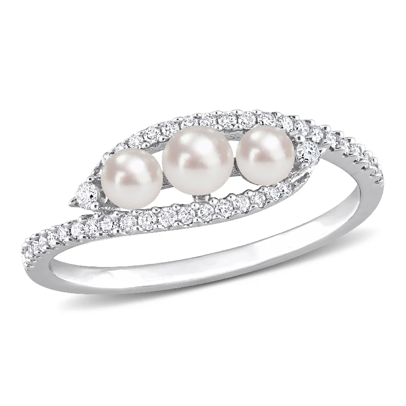 Rings with wave patterns for ocean vibes -Cultured Freshwater Pearl and 1/5 CT TDW Diamond Bypass Ring in 14k White Gold