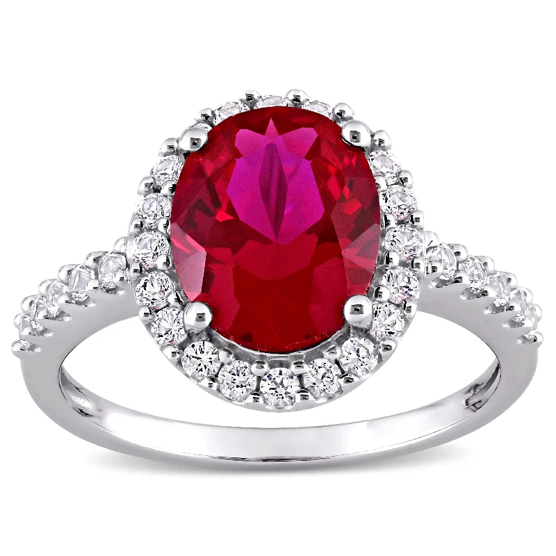 Rings with polished tourmaline for vibrant shine -Miadora 10k White Gold Oval-cut Created Ruby and Created White Sapphire Halo Engagement Ring