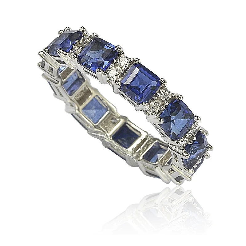 Rings with gothic-inspired skull motif details -Suzy Levian Sterling Silver Sapphire and Diamond Accent Eternity Band