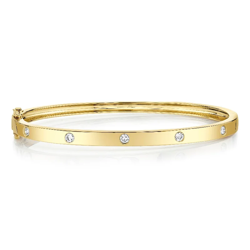 Chunky bangle bracelets with metallic finishes for a bold and statement-making look-0.38ctw Diamond Bangle