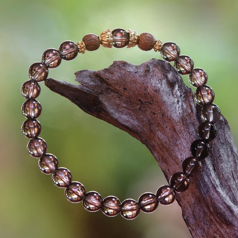 Wide bangle bracelets with animal print designs for a bold and exotic look-Batuan Tune Smoky Quartz Beaded Stretch Bracelet with Wood Accents