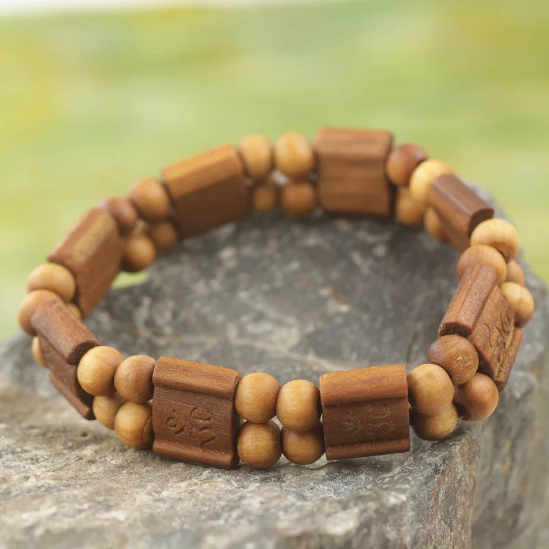 Bangle bracelets with hand-painted designs for an artistic and colorful look-Brown Radiance Artisan Crafted Sese Wood Stretch Bracelet from Ghana