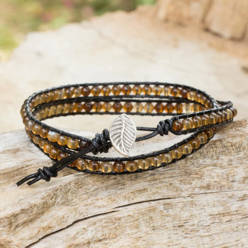 Best bangle bracelets with customizable charms for a personalized, unique piece-Hill Tribe Sun Handcrafted Thai Black Leather Bracelet with Golden Agate