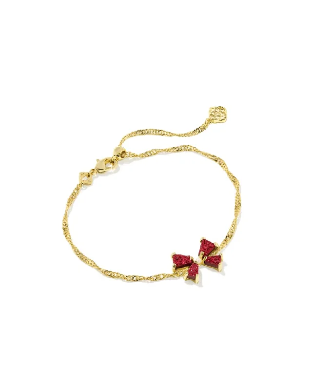 Best bangle bracelets with intricate filigree work for an artisanal, vintage vibe-Kendra Scott Blair Gold Bow Delicate Chain Bracelet in Bright Red Drusy