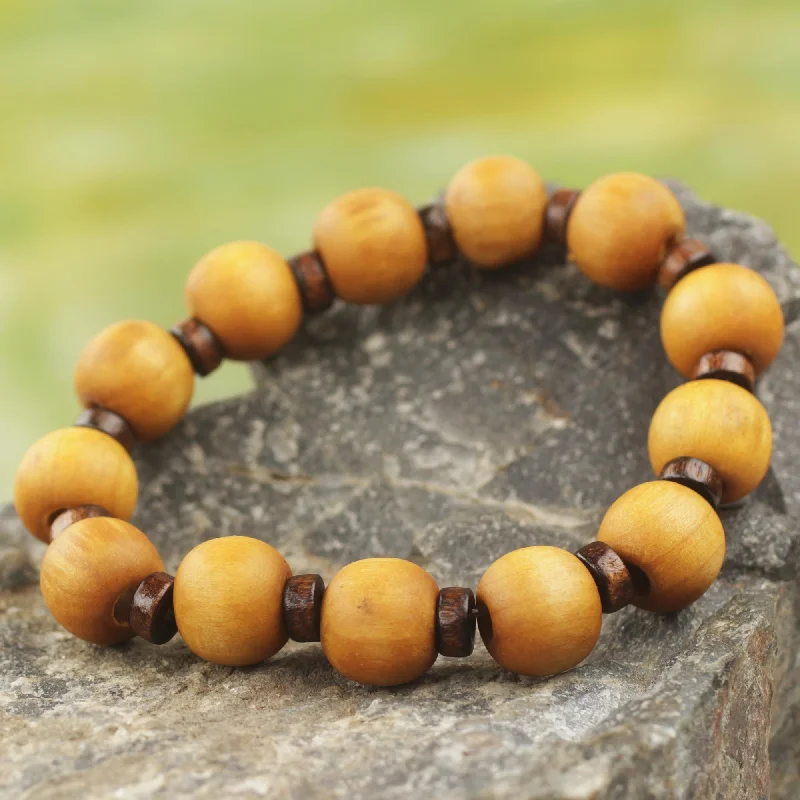 Minimalist bangle bracelets with a thin profile for a sleek and subtle appearance-Labadi Warmth Handcrafted Stretch Bracelet with Wood Beads