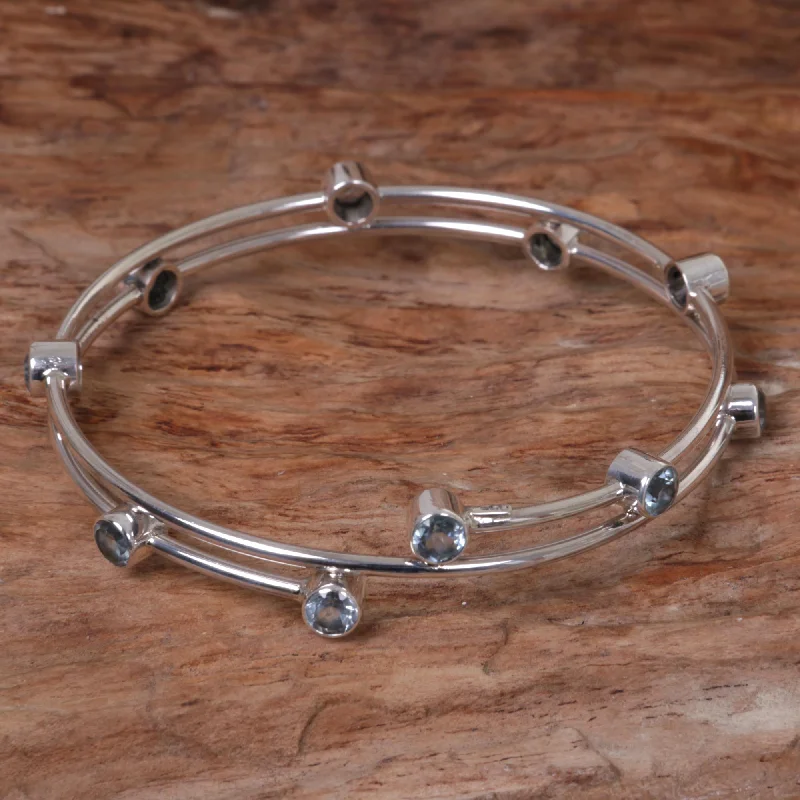 Best bangle bracelets with hand-crafted details for a unique and artisanal touch-Orchid Twist in Blue Topaz & Silver Bangle Bracelet