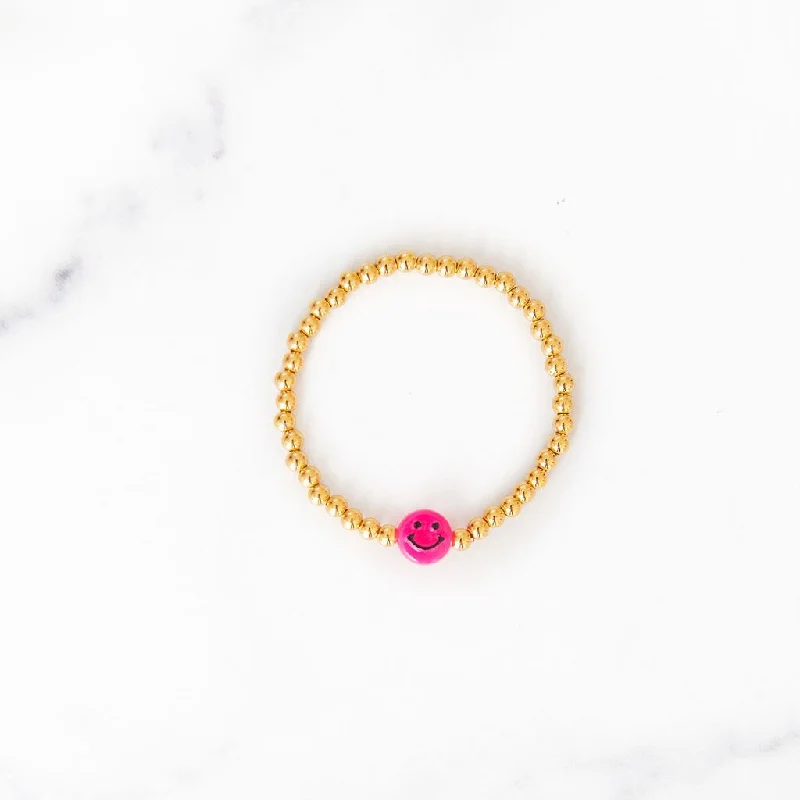 Best bangle bracelets with twisted rope designs for a textured, nautical-inspired look-Pink Smiley Face Gold Beaded Bracelet