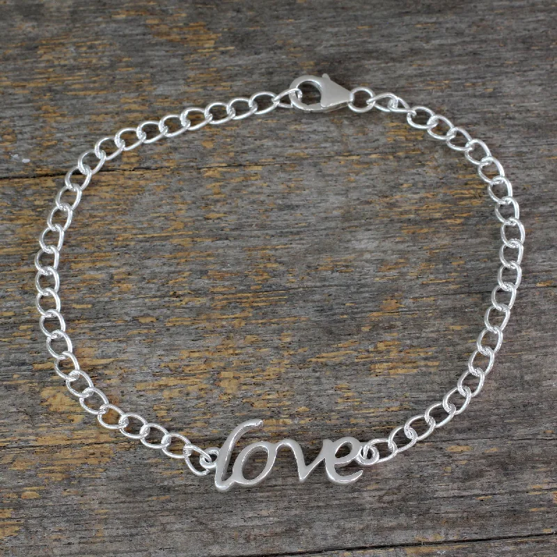 Best bangle bracelets with cubic zirconia inlays for affordable elegance and sparkle-Remember to Love Love Themed Bracelet Hand Crafted from Sterling Silver